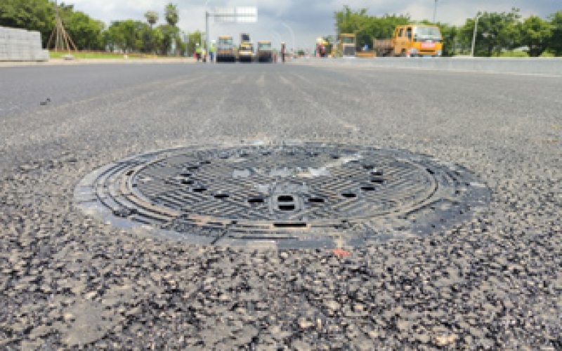 Manhole Cover Lifting During Asphalt Paving